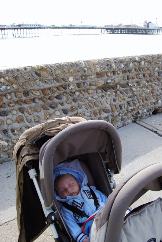 Conrad sleeping by the sea in Brighton.jpg
